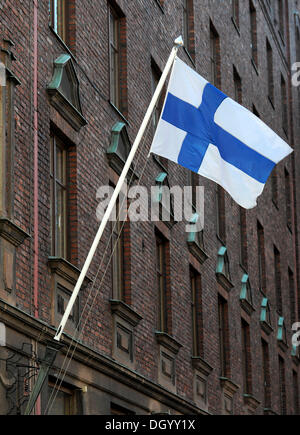 National flag of Finland flying in the wind, Finland, Europe Stock Photo