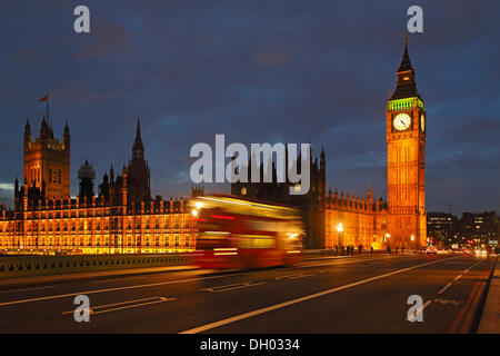 Westminster Bridge, Elizabeth Tower or Big Ben, Houses of Parliament, passing red double-decker bus in the evening Stock Photo