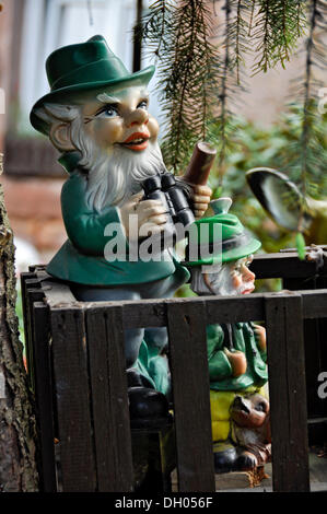Garden gnome as a hunter on a raised hide in the woods, Bueches near Buedingen, Hesse, PublicGround Stock Photo