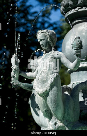 Mermaid holding fish in an Art Nouveau style fountain, Fortuna Fountain by Karl Killer, Isartorplatz, Munich, Upper Bavaria Stock Photo