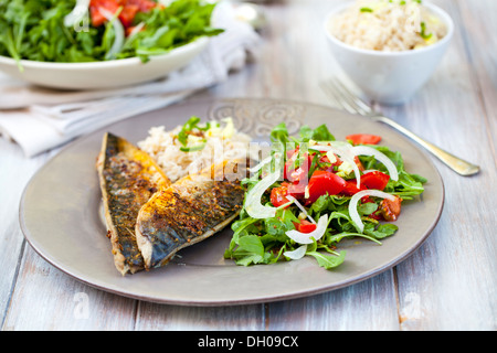 Mackerel fillets with salad and rice Stock Photo