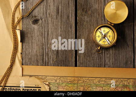 Antique compass over old map Stock Photo