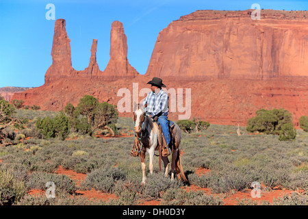 Navajo cowboy riding on a Mustang, Utah, United States Stock Photo