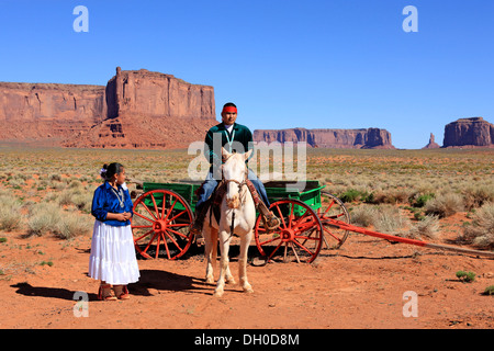 Navajo Indians, man and woman with a horse in front of a carriage, Monument Valley, Utah, United States Stock Photo