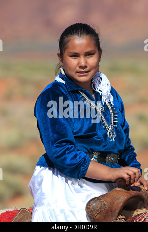 Navajo Indian woman riding a horse, Monument Valley, Utah, United States Stock Photo