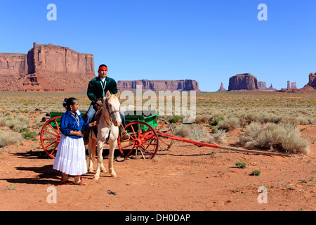 Navajo Indians, man and woman with a horse in front of a carriage, Monument Valley, Utah, United States Stock Photo