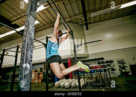 Asian woman exercising in gym Stock Photo