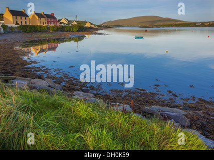 County Kerry, Ireland: Portmagee Channel with colorful houses of Portmagee and Bray Head in the distance Stock Photo