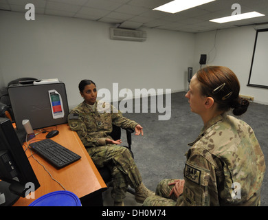 Capt. Dimple Nolly, 455th Air Expeditionary Wing Deputy Staff Judge Advocate, deployed from Spangdahlem Air Base, Germany, and a Houston native, provides legal assistance to Staff Sgt. Angela Smith, 455th Expeditionary Civil Engineer Squadron, deployed fr Stock Photo