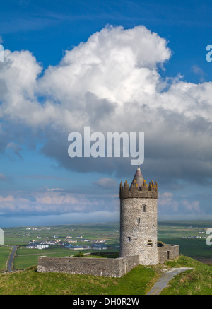 County Clare, Ireland: Round tower of Doonagore castle stands above the village of Doolin and the South Sound of Galway Bay Stock Photo