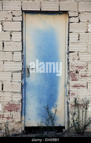Metal door two tone in brick wall Stock Photo