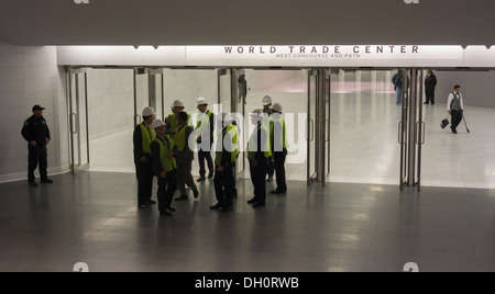 Commuters and tourists take in the marble-lined subterranean walkway connecting the World Trade Center PATH Station Stock Photo