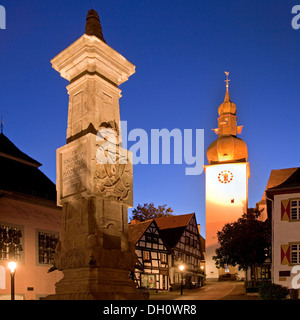 Maximilian Fountain in Alter Markt square with the old town hall and the bell tower at dusk, Arnsberg, Sauerland Stock Photo