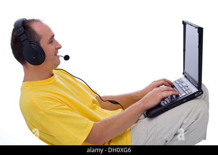 Man with laptop, instant messaging: on-line chat and talking with friends. Stock Photo