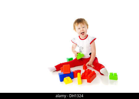 baby girl is playing with educational toys Stock Photo