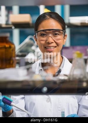 Japanese scientist working in laboratory Stock Photo