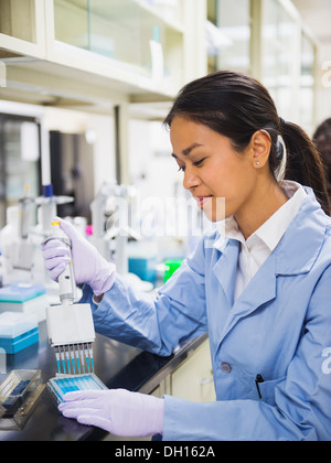 Japanese scientist working in laboratory Stock Photo