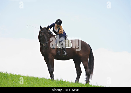 Woman Riding Horse in Rural Landscape, Baden Wuerttemberg, Germany, Europe Stock Photo