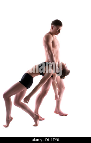 Young couple of acrobats posing in studio Stock Photo