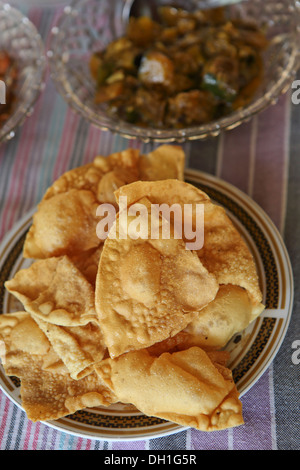 Traditional Sri Lankan rice curry dish with fresh poppadoms Stock Photo