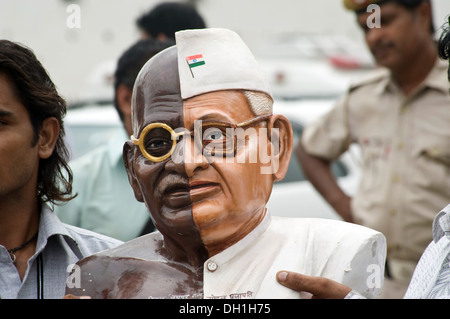 Anna Hazare supporters with statue of half Mahatma Gandhi and half Anna Hazare at ramlila maidan delhi India Asia Stock Photo