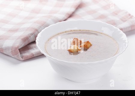 Mushrooms cream soup with agaric, closeup on white table Stock Photo
