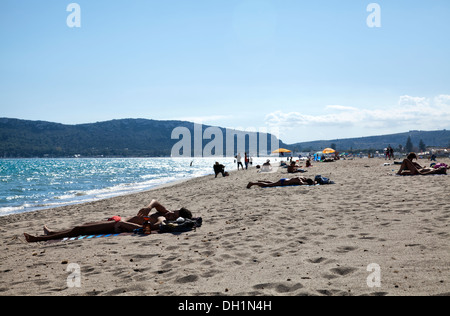 Sunbathers on Poetto Beach in Cagliari in Sardinia Stock Photo