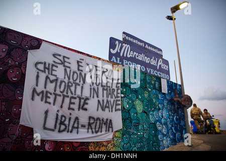 A banner for the immigrants rescued near Lampedusa, the largest island of the Italian Pelagie Islands in the Mediterranean Sea Stock Photo