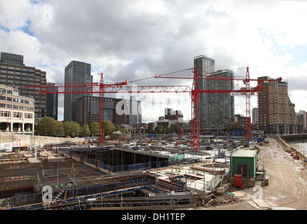 Tower cranes on a riverside construction site in London, UK Stock Photo