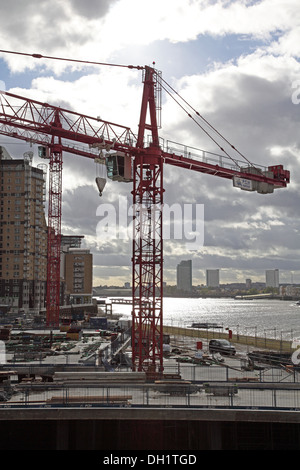 Tower cranes on a construction site next to the River Thames in London, UK Stock Photo