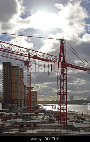 Tower cranes on a construction site next to the River Thames in London, UK Stock Photo