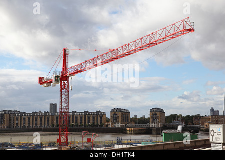 Tower crane on a riverside construction site in London, UK Stock Photo