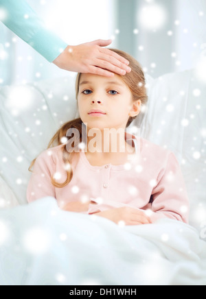 ill girl child and caring mother Stock Photo