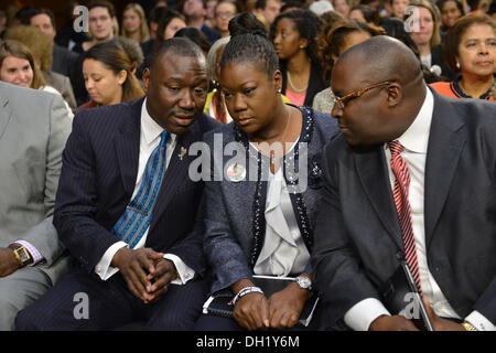 Washington, DC, USA. 29th Oct, 2013. SYBRINA FULTON, center, mother of slain Florida teenager Trayvon Martin, speaks with her attorney BENJAMIN CRUMP, left, before testifying on ''Stand Your Ground'' laws before a subcommittee of the U.S. Senate Judiciary Committee. ''I just wanted to come here to.let you know how important it is that we amend this stand your ground, '' Fulton told the senators. Credit:  Jay Mallin/ZUMAPRESS.com/Alamy Live News Stock Photo