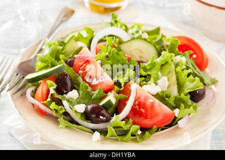 Homemade Organic Greek Salad with Tomato, Olives, and Feta Cheese Stock Photo
