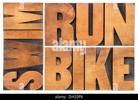 run, bike, swim - triathlon concept - isolated word abstract in vintage letterpress wood type Stock Photo