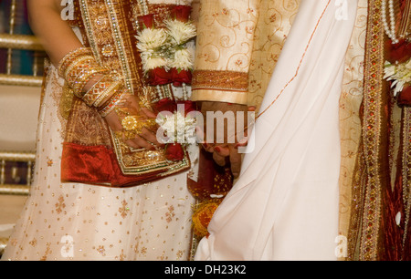 Bride and Groom dressed in all their finery celebrating their Traditional Hindu wedding. Stock Photo