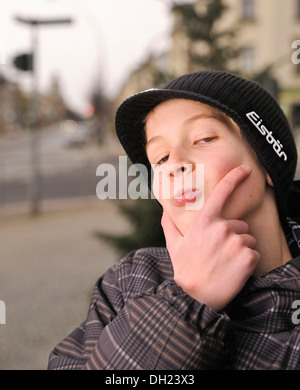 Boy, 12 or 13 years, trying to look cool, portrait Stock Photo