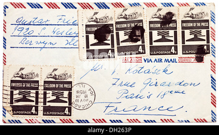 1958 American envelope addressed to France with 'Freedom of the Press' postage stamps obliterated with black mark. Stock Photo