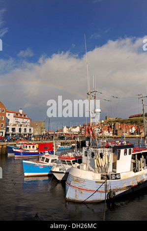 Colouful fishing boats moored up in Whitby harbour, North Yorkshire. Stock Photo