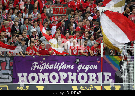 Fans of FSV Mainz 05 football club showing a banner 'Fussballfans gegen Homophobie', German for 'football fans against Stock Photo