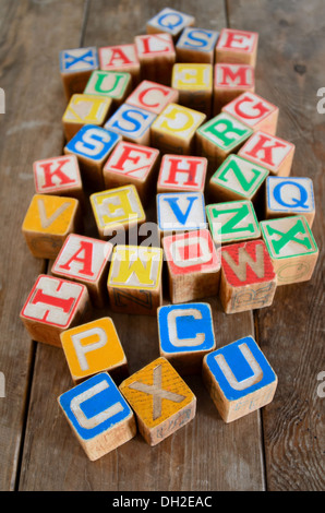 Colorful vintage wooden alphabet blocks Stock Photo