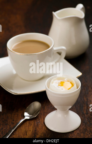 coffee with milk and boiled egg in eggcup Stock Photo
