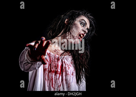 Bleeding Psychotic Woman in a Horror Themed Image Stock Photo