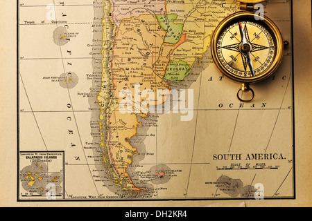 Antique compass over old XIX century map Stock Photo