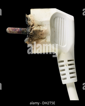 a burnt power plug in black back Stock Photo