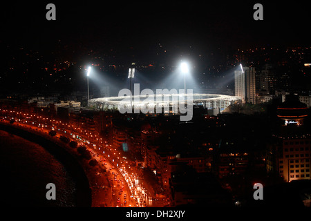 Wankhede Stadium floodlit by night on Marine Drive in Bombay Mumbai Maharashtra India Asia Stock Photo