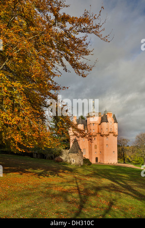 CRAIGIEVAR CASTLE IN AUTUMN WITH BEECH TREE AND LEAVES ABERDEENSHIRE SCOTLAND Stock Photo
