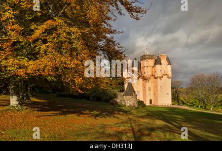 CRAIGIEVAR CASTLE IN AUTUMN SUNSHINE SURROUNDED BY BEECH TREES WITH AUTUMNAL LEAVES ABERDEENSHIRE SCOTLAND Stock Photo