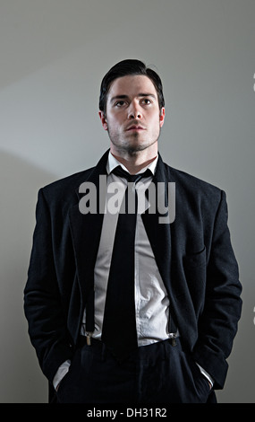 Old style man standing in a vintage suit Stock Photo